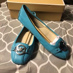 Michael Kors flats wore once and very well stored.